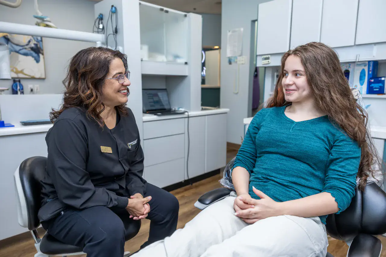 A Radiant Dentistry of Woburn hygienist caring for a patient chairside