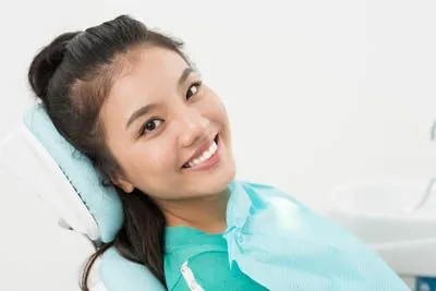 woman smiling during her visit to Radiant Dentistry of Woburn