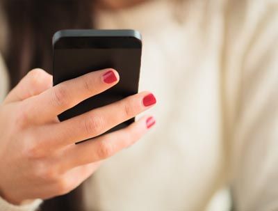woman calling Radiant Dentistry of Woburn