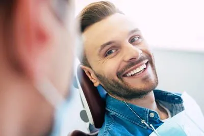 man smiling during his dental appointment