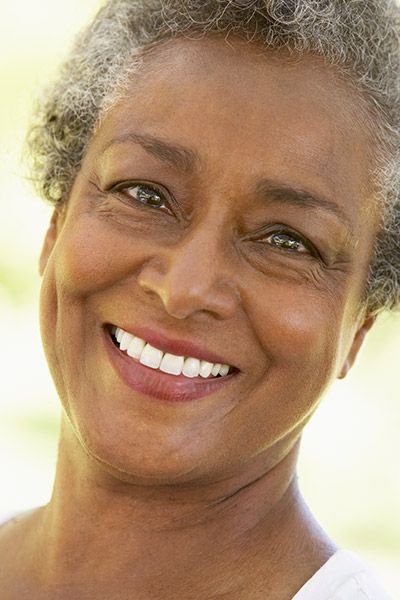 woman loving her restored smile thanks to Radiant Dentistry of Woburn