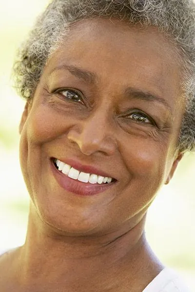 woman loving her restored smile thanks to Radiant Dentistry of Woburn