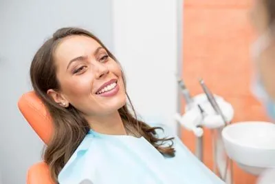 woman smiling in the dental chair