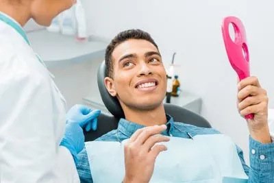 man loving the results of his dental care at Radiant Dentistry of Woburn