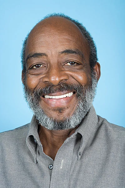 man smiling with dental implants from Radiant Dentistry of Woburn